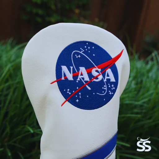 A white driver headcover with the NASA insignia